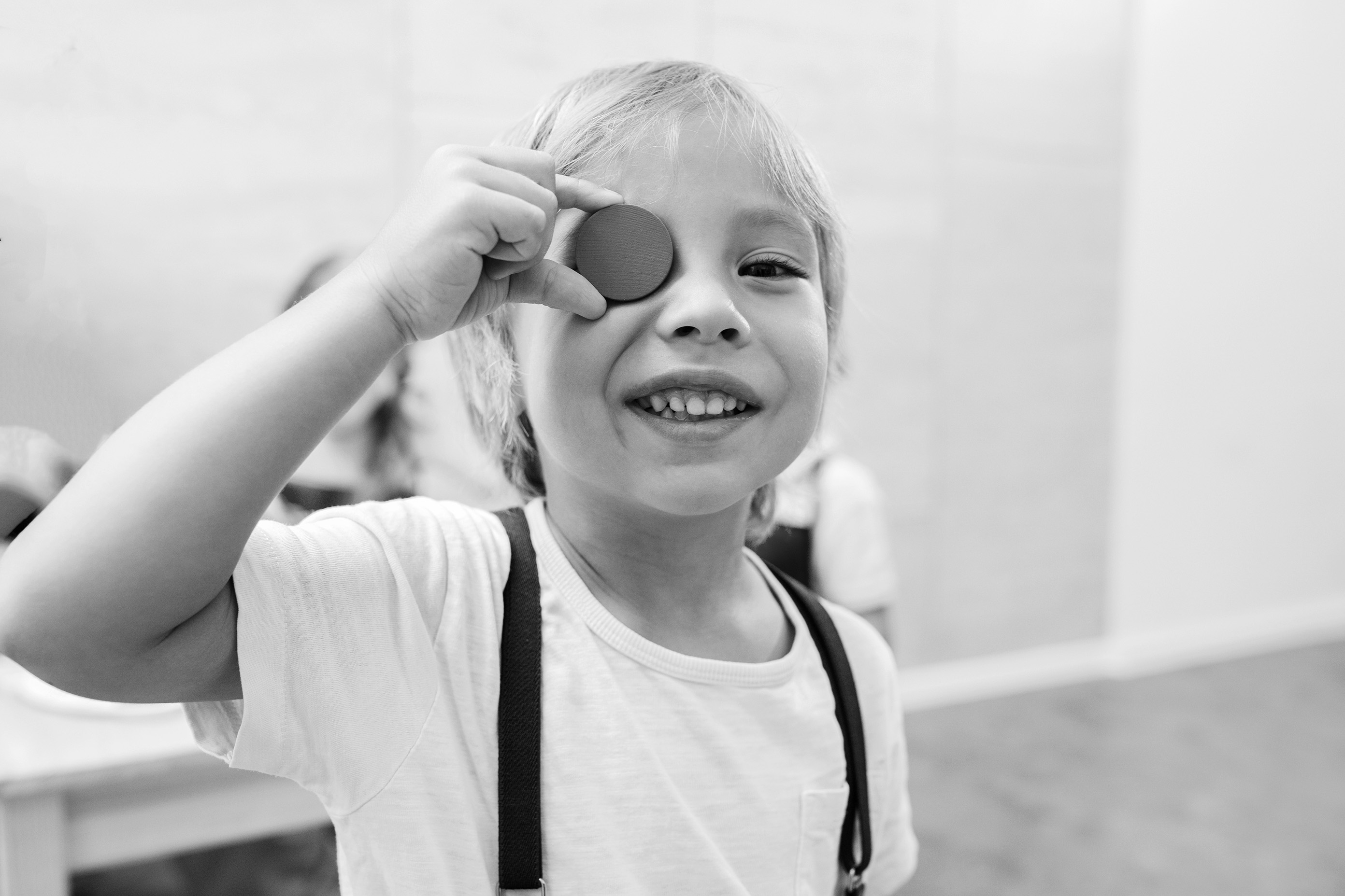 Black and white image of a boy working on math problems